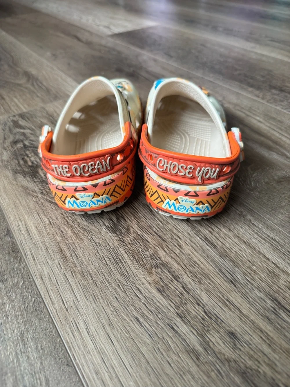 Disney Moana CROCS Kids Beige Clogs with Bright Orange Trim and Colorful Charms
